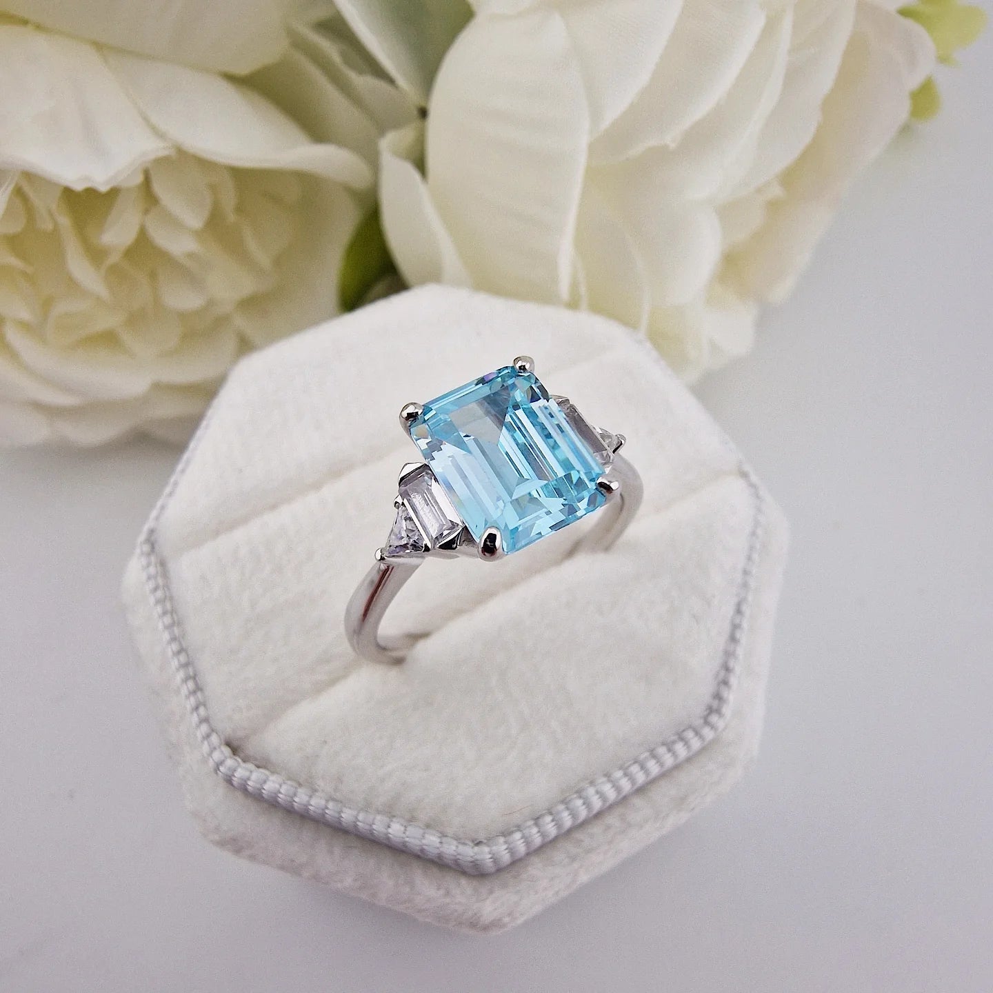 925 Sterling Silver Aqua CZ Emerald Cut Ring with Trillion Side Stones
