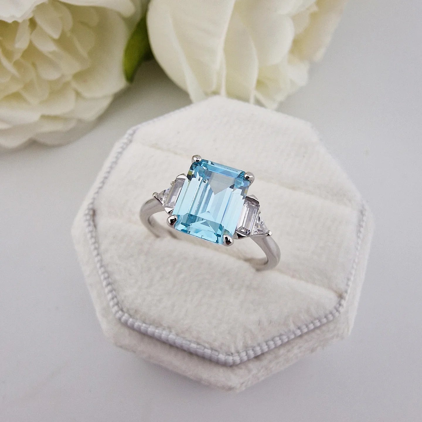 925 Sterling Silver Aqua CZ Emerald Cut Ring with Trillion Side Stones