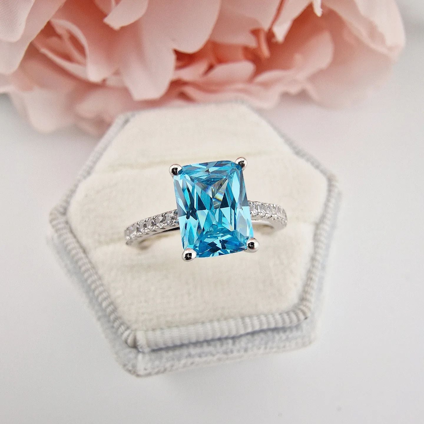 925 Sterling Silver Blue Emerald Cut Cz with Round Cz Shoulders Ring