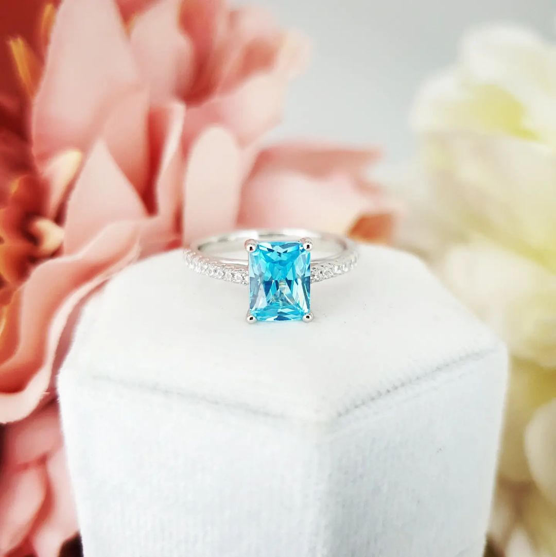 925 Sterling Silver Blue Emerald Cut Cz with Round Cz Shoulders Ring