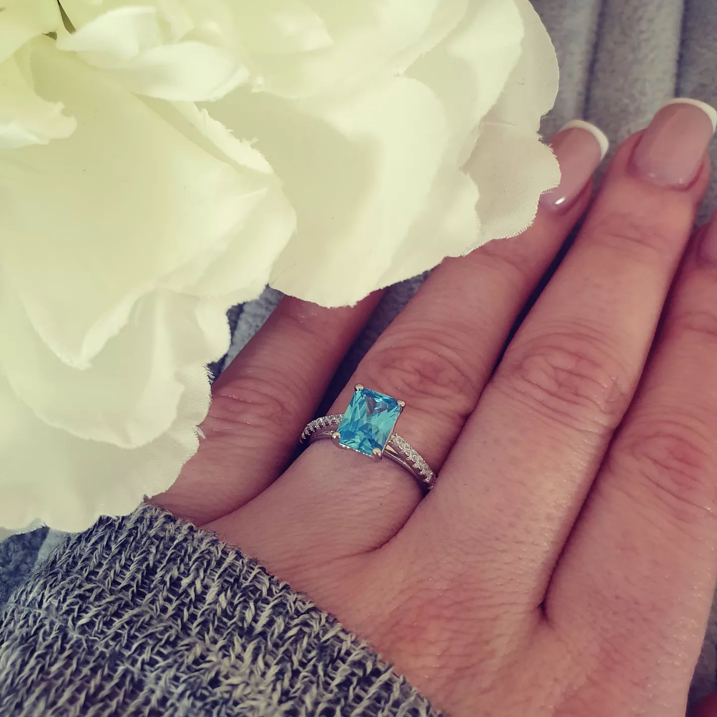 925 Sterling Silver Blue Emerald Cut Cz with Round Cz Shoulders Ring